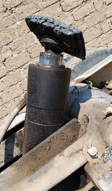 atım qurğu b: Bu, bir hidravlik silindrdir. Bu silindr ağır yüklərin qaldırılması və — 1