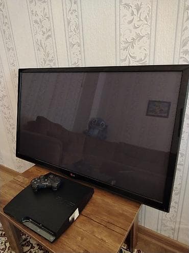 купить playstation 1: Sony PlayStation 3 (PS3) Slim + DualShock 3 gamepad + LG televizor — 2