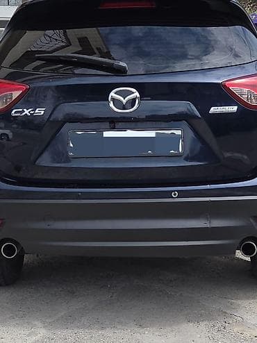 bmw x1 20d xdrive: Mazda CX-5: 2 l | 2014 il Krossover — 2