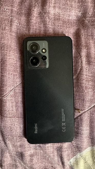 note 30: Xiaomi Redmi smartfon - Model: Redmi (şəkildəki arxa qapaqda “Redmi” — 3
