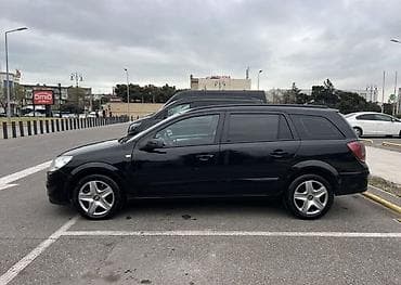 opel astra 2017: Opel Astra H Caravan (universal) – qara rəngdə, 5 qapılı şəhər və ailə — 3