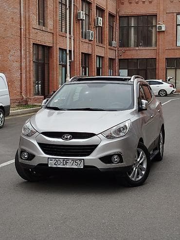 kia caren 2012: Hyundai ix35: 2 l | 2011 il Krossover — 2