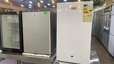 arcelik soyuducu: Ağ rəngdə, yığcam dizayna malik soyuducu. Üzərində "WOF" brendinin — 1