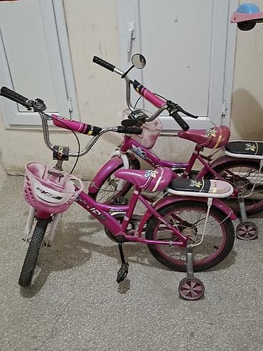 14 lük: Uşaq velosipedi – pink rəngdə, 2 ədəd Xüsusiyyətlər: - Təxminən 14 — 2