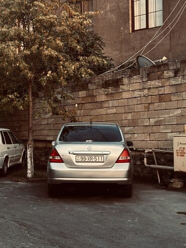 mersedes disk r15: Nissan Tiida: 1.6 l | 2006 il Sedan — 8