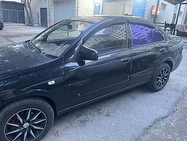 klas 6: Nissan Sunny: 1.6 l | 2008 il Sedan — 2