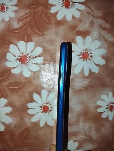 qaz pecinin temiri: Məhsul: Mavi rəngli smartfon Xüsusiyyətlər: - Korpus: yan panel mavi — 1