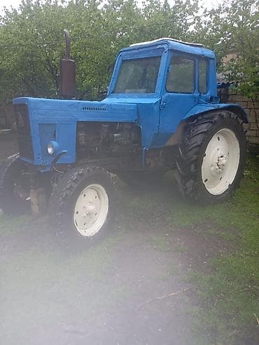 T 80 usdunde lafet mala rotor arxadan. Mavi rəngdə kabinəli traktor və lalafo.az -da T 80 usdunde lafet mala rotor arxadan. Mavi rəngdə kabinəli traktor və