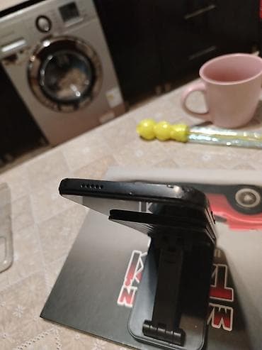 telefon saxlayan: Redmi A1+, 32 GB, rəng - Qara, Barmaq izi — 5