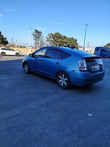 ford ehtiyat hisseleri: Toyota Prius (2-ci nəsil) hibrid hetçbek - Rəng: mavi - Salon: boz — 9
