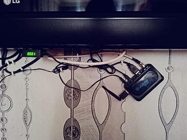 LG divar tipli televizor + Yupiter TV qutusu (IP/OTT set-top box) — 2