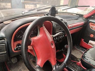 opel tigra 2005: GAZ Volga 3110, qara rəng, sedan kuzov. Xüsusiyyətlər: - Klassik xrom — 9