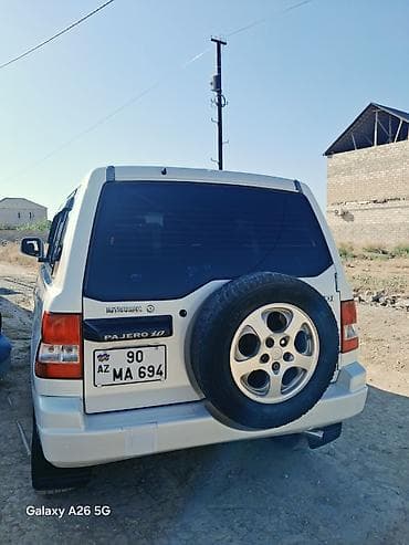 pajero mini: Mitsubishi Pajero iO, ağ rəngli, 5 qapılı kompakt SUV. - Benzinlə — 1