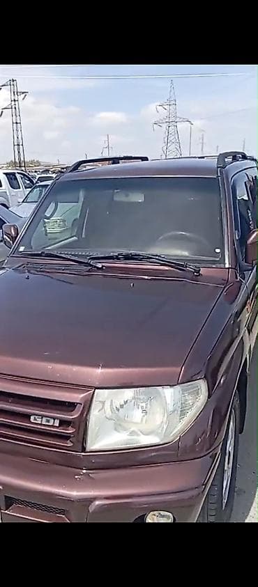mitsubishi lancer: Mitsubishi Pajero iO/GDI, tünd bənövşəyi (şokolad) rəng. - Kuzov: 5 — 6