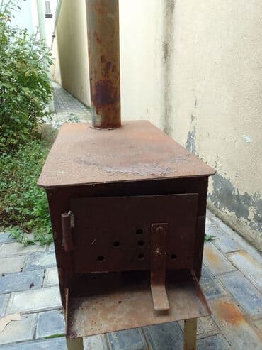 işlənmiş turbalar: Odun peçi işlənmişqalın dəmirdən düdkeşnən bir yerdə satılır — 2