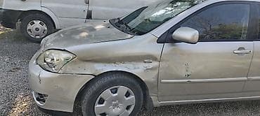 kotan satisi: Toyota Corolla sedan – gümüşü rəng • Kuzov: 4 qapı, ön sağ tərəfdə — 2
