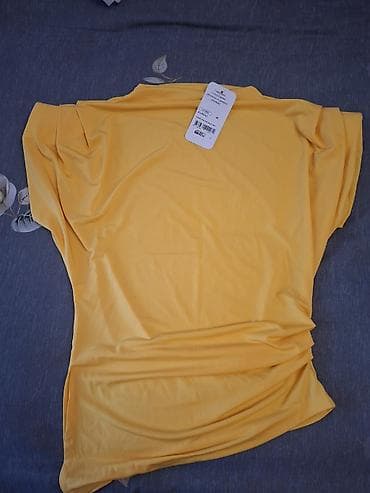 - Məhsul: Qadın bluz/kofta - Rəng: Parlaq sarı - Ölçü: 40 (etiketdə