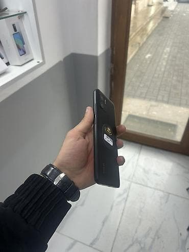 телефон fly q: Poco C40, 64 ГБ, цвет - Черный, Отпечаток пальца — 2