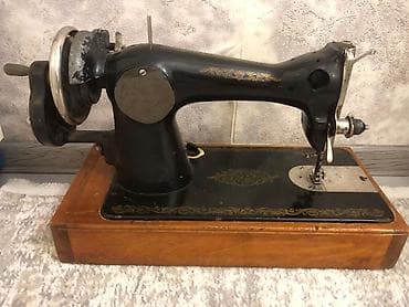 taxta qaşıq: Klassik mexaniki tikiş maşını - Çuqun korpuslu, ağır və sabit — 1