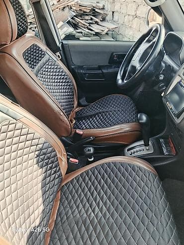 pajero mini: Mitsubishi Pajero iO, ağ rəngli, 5 qapılı kompakt SUV. - Benzinlə — 5