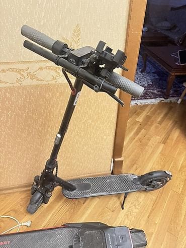 Mi M365 elektrik skuter. Elave Amortizatorlar qoyulub, telefon