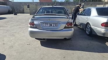 ford focus hatchback: Mitsubishi Lancer: 1.6 l | 2006 il 466000 km Sedan — 4