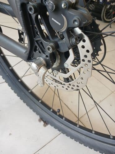 шоссейный велосипед trinx: Qara rəngli, Shimano Altus əyləc dəstəyi olan velosiped. Dəstək rahat — 7
