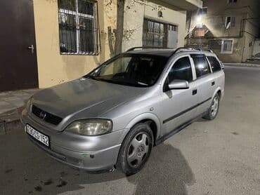 чемодан с инструментами для автомобиля: Opel Astra Caravan (universaI) – gümüşü rəngdə, 5 qapılı ailə və yük — 5