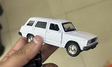 oyuncaq dovsan sekilleri: Metal korpuslu model avtomobil – ağ rəngli VAZ 2104 (steyşn-vegon) — 4