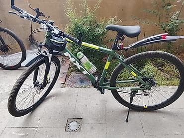 velosiped kameri: MTB tipli şəhər/dağ velosipedi – yaşıl gövdə, NX7 brend işarələri — 2