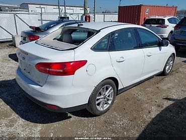 şevralit avtomobil: Ford Focus sedan, ağ rəng. - Kuzov: 4 qapılı sedan, aerodinamik qabaq — 9