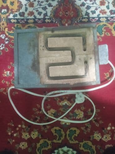 ucuz xaladelnikler: Bu elektrikli qızdırıcı plitə metal korpusda yerləşir və keramika — 2