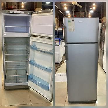 Soyuducu Paltaryuyan televizor vitrinlerin satış mərkəzi: Gümüşü rəngdə, üst donduruculu soyuducu. Bu model mətbəxdə qida