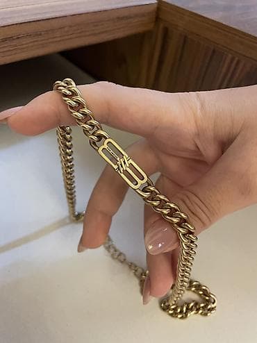 Balenciaga boyunbağı satılır. Qızılı rəngdə, BB Icon modelidir. Yaxşı — 2