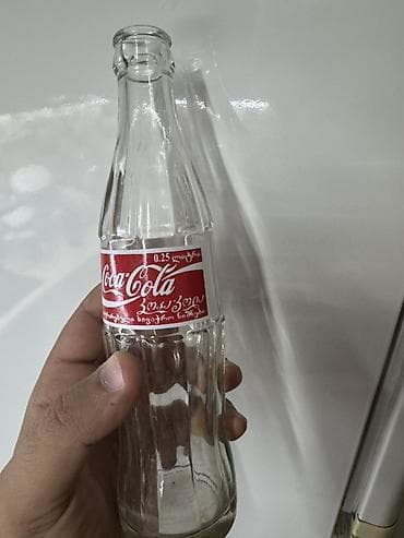 Məhsul: Şüşə Coca‑Cola butulkası Təsvir: - Həcm: 0.25 L (etiketdə — 2