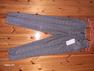 женские оранжевые брюки: 36 razmer Etiketi üzərindədir balaca olduğu üçün satılır — 1