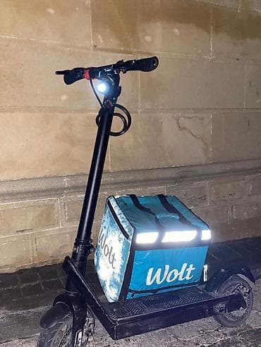 sur: Elektrik skuter + Wolt termobağlaması Məhsulun təsviri: - Şəhər içi — 1