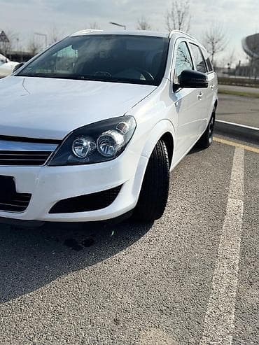 afdomobil: Opel Astra Caravan (Universal) - Kuzzov: universal (Caravan), ağ rəng — 9