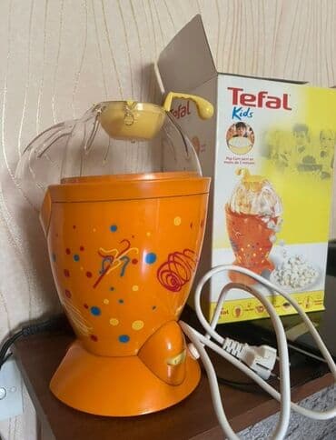 Tefal Kids popkorn aparatı. Şəffaf qapağı və qarğıdalı üçün sarı ölçü lalafo.az -da Tefal Kids popkorn aparatı. Şəffaf qapağı və qarğıdalı üçün sarı ölçü