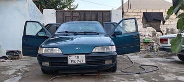 maşın al: Daewoo Espero sedan - Kuzov: sedan, tünd yaşıl rəng - Ön və arxa işıq — 1