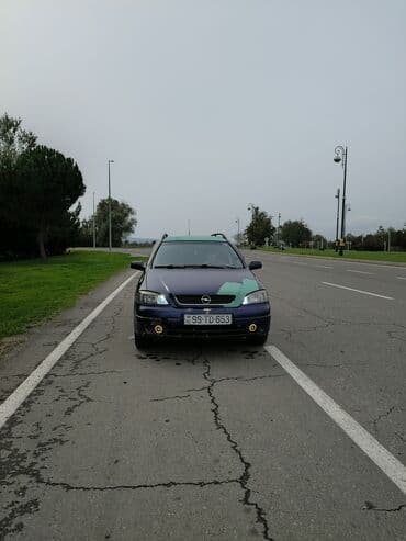 опель астра универсал: Opel Astra Caravan (universal) – mavi rəngli, ön tərəfdən geniş — 2