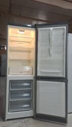 Mikrodalğalı sobalar: Gümüş rəngli, aşağıda dondurucu bölməsi olan iki qapılı soyuducu — 2