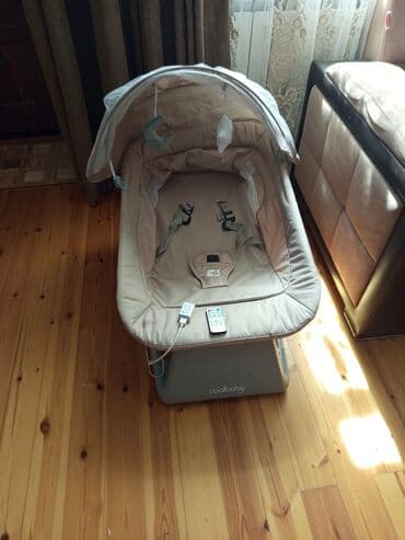 uşaq yellənçəyi: Coolbaby markalı elektrik uşaq yelləncəyi, ağ rəngdədir. Bu — 5