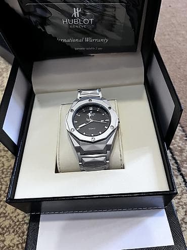 Hublot Geneve kişi qol saatı – kvarz mexanizmli, şık və minimal