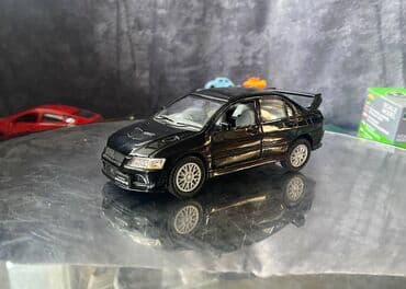 maşın modeli: Коллекционная модель Mitsubishi Lancer Evolution VII black 2002 — 3