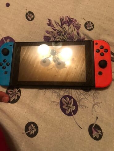 Video oyunlar üçün aksesuarlar: Portativ və ev konsolu kimi istifadə edilə bilən Nintendo Switch — 2