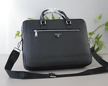 - Qara rəngdə şık iş/kompüter çantası - deri materialdan korpus -