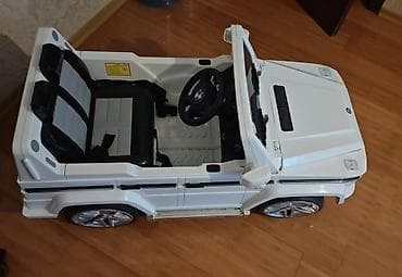 oyuncaq masınlar: Uşaq üçün elektrikli minik maşını – ağ rəng, “G 55 AMG” üslubunda — 2