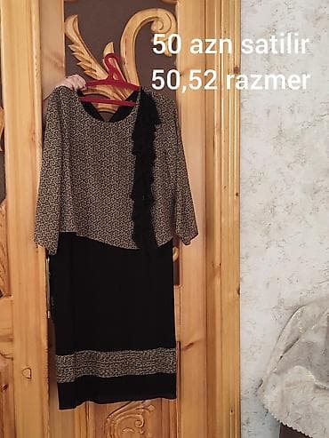 Qadın paltarı – klassik üslubda, qara rəng əsaslı, üst hissəsi naxışlı