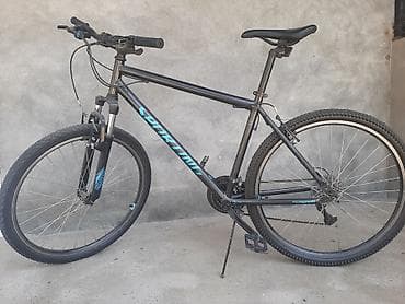 dağ velosipedi: Specialized markalı dağ/şəhər tipli velosiped. Qara rəngli çərçivəyə — 1